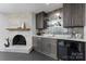 Stylish bar area with stone accent wall, modern cabinets, and a built-in wine cooler at 3701 Table Rock Rd, Charlotte, NC 28226