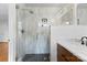 Modern bathroom with glass-enclosed shower, stylish fixtures, and vanity with marble countertop at 3701 Table Rock Rd, Charlotte, NC 28226