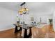 Dining area with modern table and lighting, seamlessly connecting to the living spaces at 3701 Table Rock Rd, Charlotte, NC 28226
