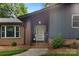 Welcoming front entrance with modern door, brick accents, and fresh landscaping at 3701 Table Rock Rd, Charlotte, NC 28226