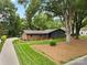 Charming home with brick and gray painted exterior, a manicured lawn, and mature trees at 3701 Table Rock Rd, Charlotte, NC 28226