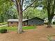 Charming single-story home with brick and siding, complemented by a well-manicured lawn and mature trees at 3701 Table Rock Rd, Charlotte, NC 28226