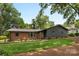 Charming brick home with a well-manicured lawn and mature trees in a serene neighborhood at 3701 Table Rock Rd, Charlotte, NC 28226