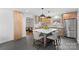 Spacious kitchen featuring a large island with bar seating, stainless steel appliances, and ample cabinet space at 3701 Table Rock Rd, Charlotte, NC 28226