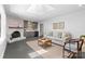 Bright living room with fireplace, bar area, skylight, and comfortable seating at 3701 Table Rock Rd, Charlotte, NC 28226