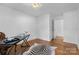 Bright office with hardwood floors, natural light, and a zebra-print rug at 3701 Table Rock Rd, Charlotte, NC 28226