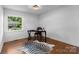 Bright office with hardwood floors, natural light, and a zebra-print rug at 3701 Table Rock Rd, Charlotte, NC 28226