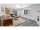 Open floor plan showcases a modern living area, kitchen, and plenty of natural light at 3701 Table Rock Rd, Charlotte, NC 28226