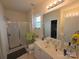 Bright bathroom with shower, mirror, and white vanity at 4032 Wilgrove Way Dr # 252, Charlotte, NC 28213