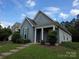 Well-maintained home exterior with lush lawn and charming front entry on a sunny day at 4032 Wilgrove Way Dr # 252, Charlotte, NC 28213