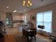 Bright eat-in kitchen with white cabinets and modern appliances at 4032 Wilgrove Way Dr # 252, Charlotte, NC 28213
