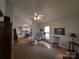 Inviting living room with hardwood floors, ceiling fan, and cozy furniture arrangement at 4032 Wilgrove Way Dr # 252, Charlotte, NC 28213