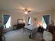 Spacious bedroom with ceiling fan, neutral walls, blue curtains and carpet flooring at 4032 Wilgrove Way Dr # 252, Charlotte, NC 28213