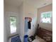 Mud room with coat hooks, shoe storage, and an exterior door leading to an outdoor seating area at 4032 Wilgrove Way Dr # 252, Charlotte, NC 28213