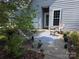 Relaxing backyard patio area with seating, greenery, and outdoor decor at 4032 Wilgrove Way Dr # 252, Charlotte, NC 28213