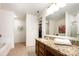Bathroom features a granite vanity top, large mirror, and shower/tub combo at 4068 Sherri Ln, Fort Mill, SC 29715