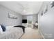 Serene bedroom with light gray walls, ceiling fan, and a desk with a view at 4068 Sherri Ln, Fort Mill, SC 29715