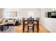 Open concept dining room featuring a wooden table, six chairs, and a seamless transition into the living area at 4068 Sherri Ln, Fort Mill, SC 29715