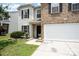 Traditional two-story home featuring brick and siding exterior, well-manicured front lawn, and a two-car garage at 4068 Sherri Ln, Fort Mill, SC 29715