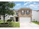 Charming two-story home with a brick and siding facade, well-manicured lawn, and attached garage at 4068 Sherri Ln, Fort Mill, SC 29715