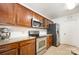 Spacious kitchen boasting stainless steel appliances, granite countertops, and classic wooden cabinetry at 4068 Sherri Ln, Fort Mill, SC 29715