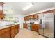 Modern kitchen equipped with stainless steel appliances, granite countertops, and wooden cabinets at 4068 Sherri Ln, Fort Mill, SC 29715