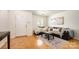 Comfortable living room showcasing hardwood floors, a cozy couch, a coffee table, and a bright front door at 4068 Sherri Ln, Fort Mill, SC 29715
