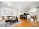 Inviting living room features hardwood floors, a plush couch, and a dining area perfect for gatherings at 4068 Sherri Ln, Fort Mill, SC 29715