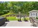 Beautiful backyard featuring a deck, fire pit, and beautifully landscaped area at 4313 Wynborough Ln, Charlotte, NC 28269