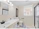 Bathroom features a single vanity, toilet, shower, and window with blinds at 4313 Wynborough Ln, Charlotte, NC 28269