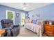 Cozy bedroom with daybed, chair, and plenty of natural light from the two windows at 4313 Wynborough Ln, Charlotte, NC 28269