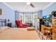 Bedroom features a bay window, wood furniture, television, and ceiling fan at 4313 Wynborough Ln, Charlotte, NC 28269