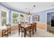 Charming dining room with natural light, chair rail, and a decorative light fixture at 4313 Wynborough Ln, Charlotte, NC 28269