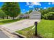Attractive one-story home featuring a meticulously maintained lawn and an extended driveway leading to an attached two-car garage at 4313 Wynborough Ln, Charlotte, NC 28269