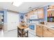 Cozy eat-in kitchen with modern appliances, light wood cabinets and blue walls at 4313 Wynborough Ln, Charlotte, NC 28269