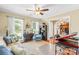 Bright living room with hardwood floors, natural light, comfortable seating, and seamless flow into the dining area at 4313 Wynborough Ln, Charlotte, NC 28269