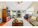 Spacious living room with hardwood floors, vaulted ceilings, brick fireplace, and comfortable seating arrangement at 4313 Wynborough Ln, Charlotte, NC 28269