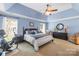 Spacious primary bedroom features tray ceilings, carpet and a large window at 4313 Wynborough Ln, Charlotte, NC 28269