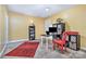 Bonus room featuring yellow walls, neutral carpet, a workstation, and a red accent chair at 460 Clouds Way, Rock Hill, SC 29732