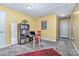 Bonus room with yellow walls, red rug, and a workstation with a desk and shelves at 460 Clouds Way, Rock Hill, SC 29732
