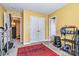 Bright exercise room with carpet, red rug, yellow walls, and weight training equipment at 460 Clouds Way, Rock Hill, SC 29732