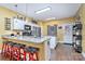 Bright kitchen featuring granite countertops, modern appliances, and a convenient breakfast bar at 460 Clouds Way, Rock Hill, SC 29732