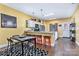 Modern kitchen with granite countertops, stainless steel appliances, and open dining area with bar stool seating at 460 Clouds Way, Rock Hill, SC 29732
