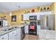 Well-equipped kitchen with granite counters, stainless appliances, and ample cabinet space for storage at 460 Clouds Way, Rock Hill, SC 29732