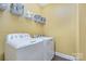 Laundry room with washer, dryer, wire shelving, and luxury vinyl tile flooring at 460 Clouds Way, Rock Hill, SC 29732