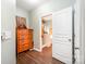 Bathroom entrance featuring wood floors, and white door leading into the bright bathroom at 4703 David Cox Rd, Charlotte, NC 28269