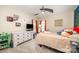 Bright bedroom featuring a ceiling fan, carpeted floors, and decor at 4703 David Cox Rd, Charlotte, NC 28269