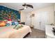 Bedroom features a ceiling fan, plush decor, and ample closet space at 4703 David Cox Rd, Charlotte, NC 28269