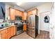 Modern kitchen featuring stainless steel appliances and ample wooden cabinets at 4703 David Cox Rd, Charlotte, NC 28269