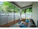 Inviting patio with comfortable seating and outdoor rug, surrounded by a white fence at 4703 David Cox Rd, Charlotte, NC 28269